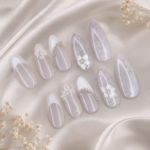 White Pearl Floral handmade press-on nails are designed for a soft, elegant salon-quality manicure at home. This set features a glossy white and sheer nude base with delicate 3D floral details, pearl accents, and lace-inspired nail art for a romantic feminine look. Perfect for brides, engagements, weddings, bridal showers, Eid, parties, and elegant everyday wear, these reusable press-on nails give you a polished manicure without a salon visit.