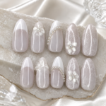 White Pearl Floral handmade press-on nails are designed for a soft, elegant salon-quality manicure at home. This set features a glossy white and sheer nude base with delicate 3D floral details, pearl accents, and lace-inspired nail art for a romantic feminine look. Perfect for brides, engagements, weddings, bridal showers, Eid, parties, and elegant everyday wear, these reusable press-on nails give you a polished manicure without a salon visit.